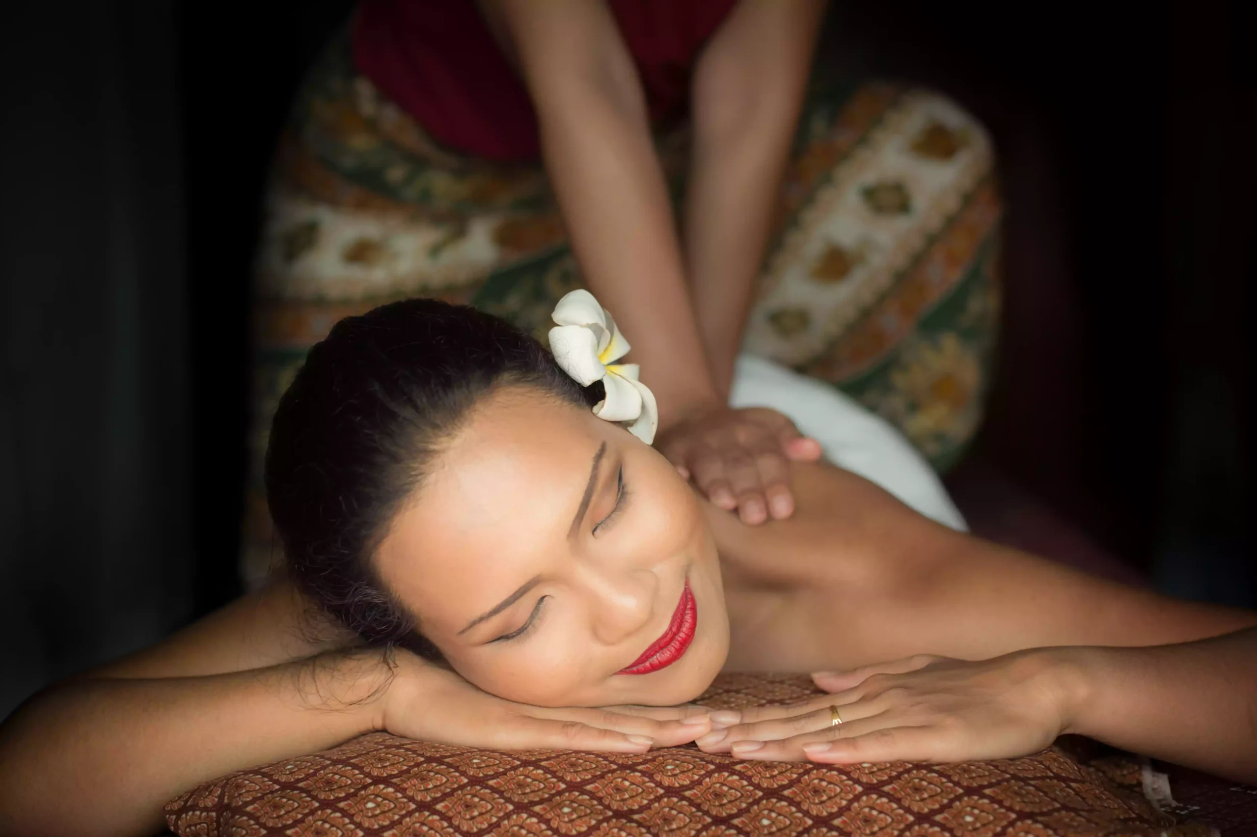 woman-giving-massage-another-woman-lying-down