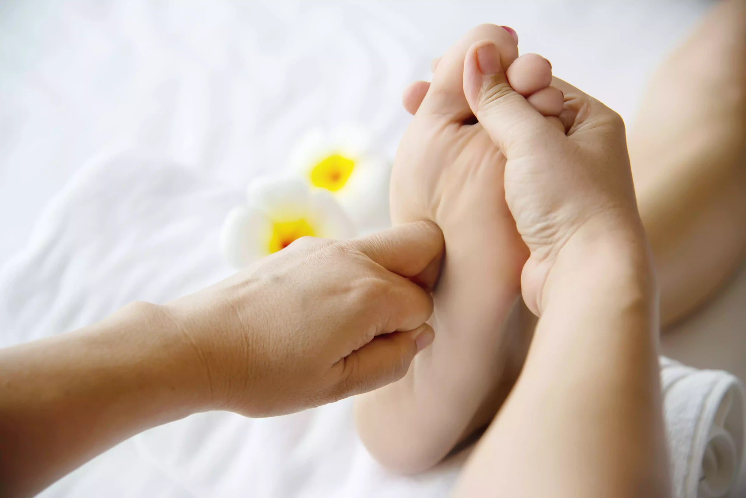 woman-receiving-foot-massage-service-from-masseuse-close-up-hand-foot-relax-foot-massage-therapy-service-concept